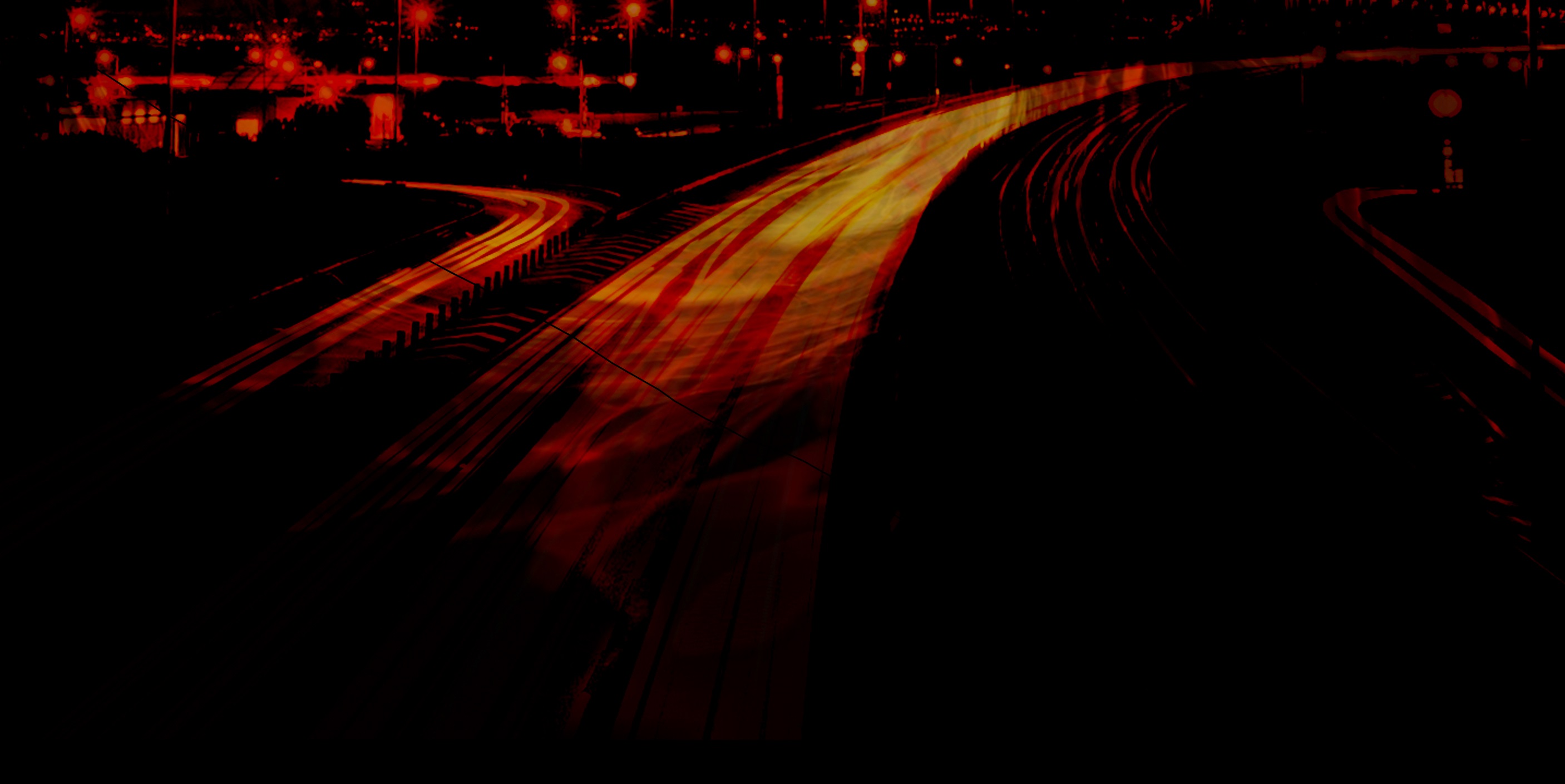 Abstract long-exposure night photograph of a curving road with red and orange light trails cutting through darkness, moody and atmospheric
